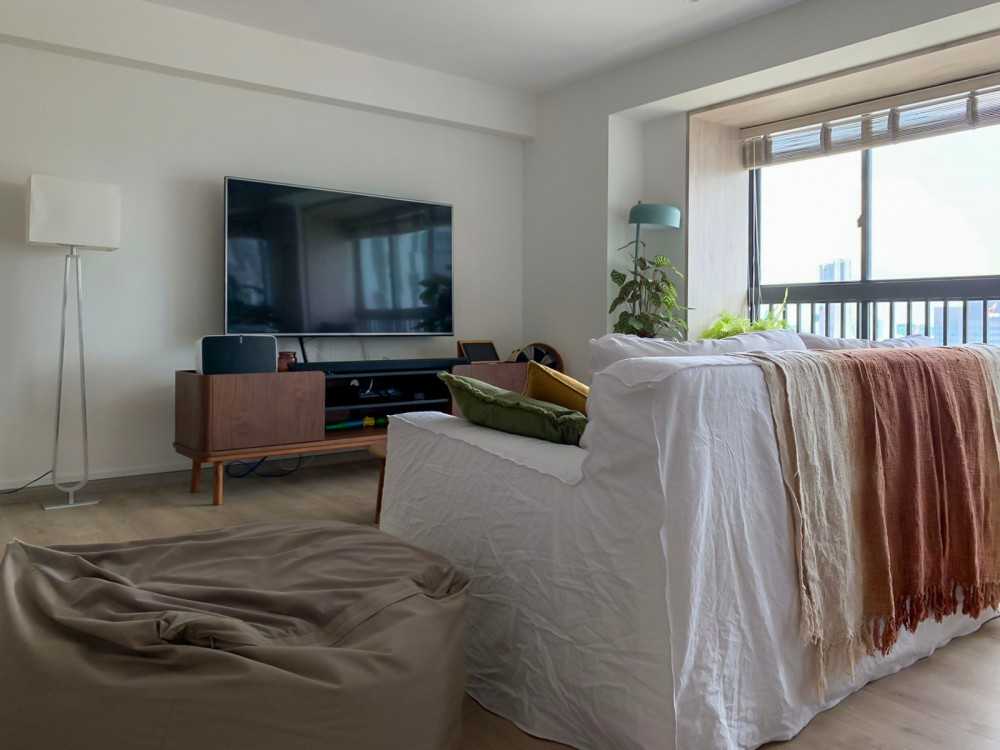 Scandinavian Living Room with TV Console and Window Seat