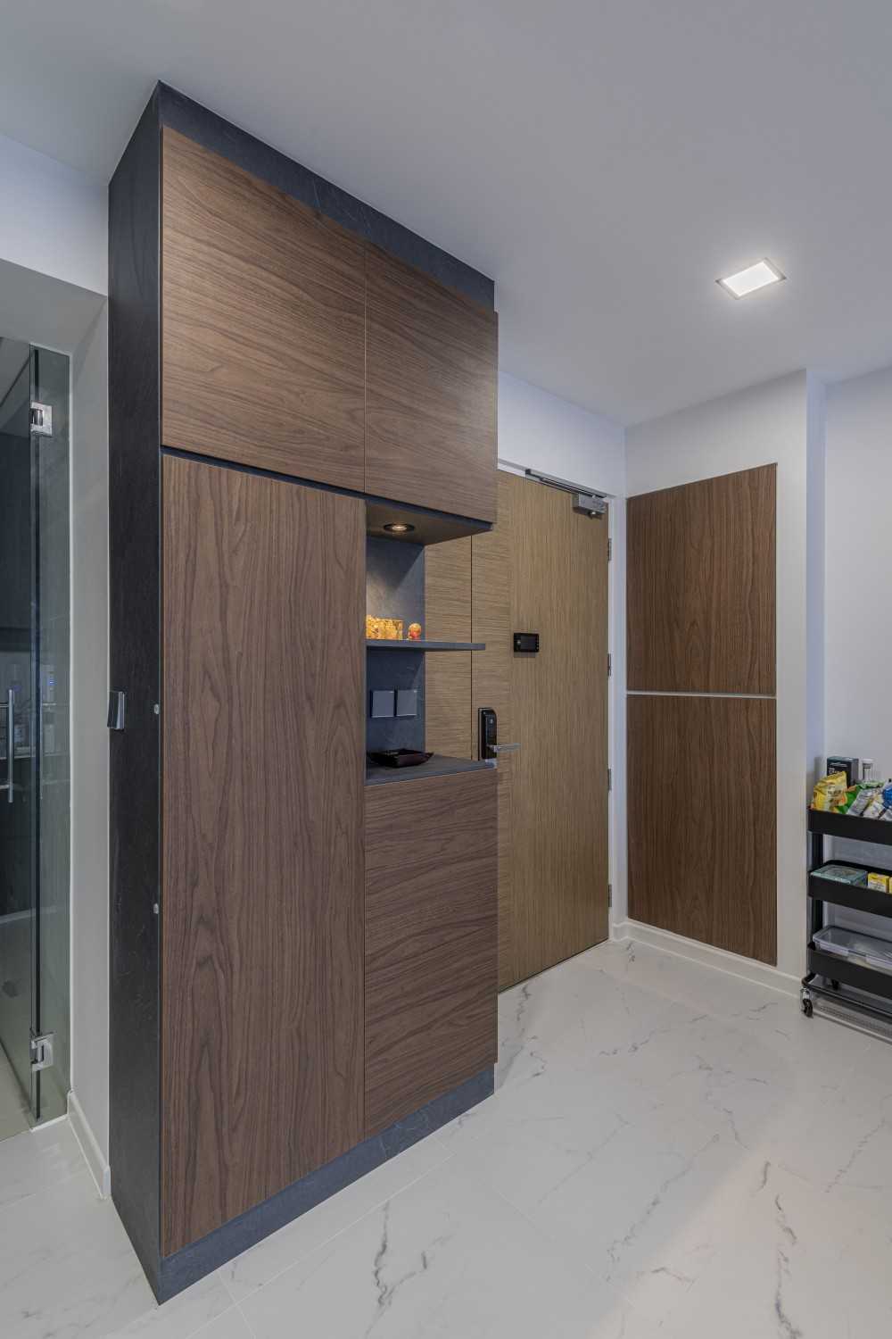 Contemporary Foyer with Artwork and Shoe Cabinets