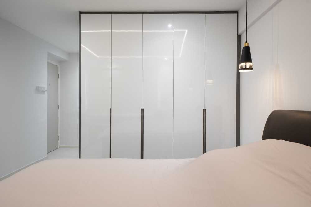 Contemporary Bedroom with Herringbone Tiling and Wardrobe