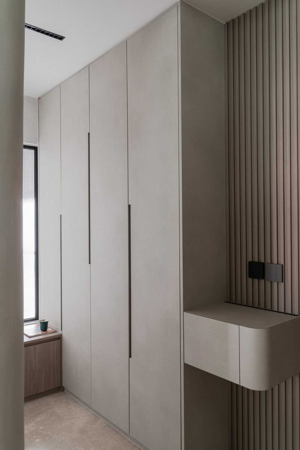 Modern Entryway with Feature Wall and Seating Bench