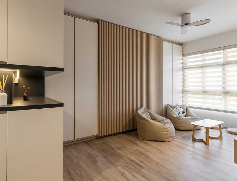 Asian Living Room with Bookshelf and Wood Flooring