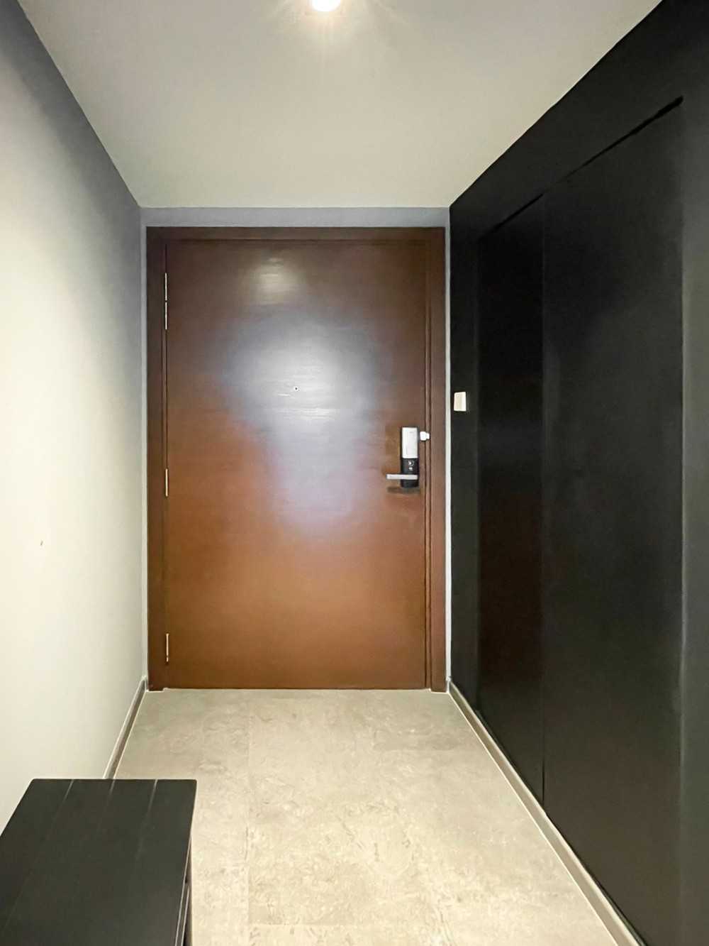 Scandinavian Entryway with Panelling and Paintings