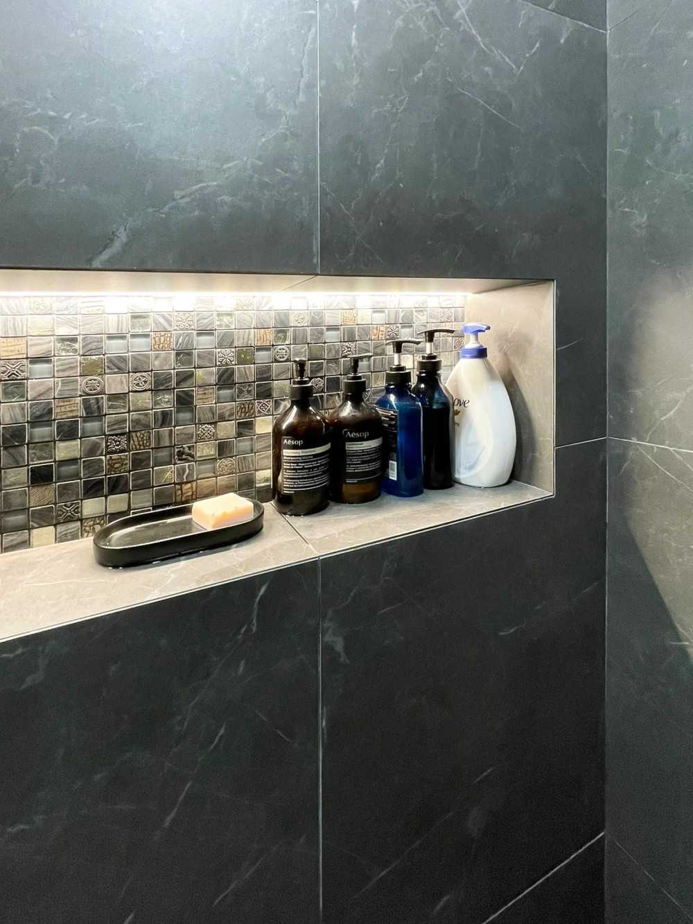 Scandinavian Bathroom with Feature Wall and Paintings