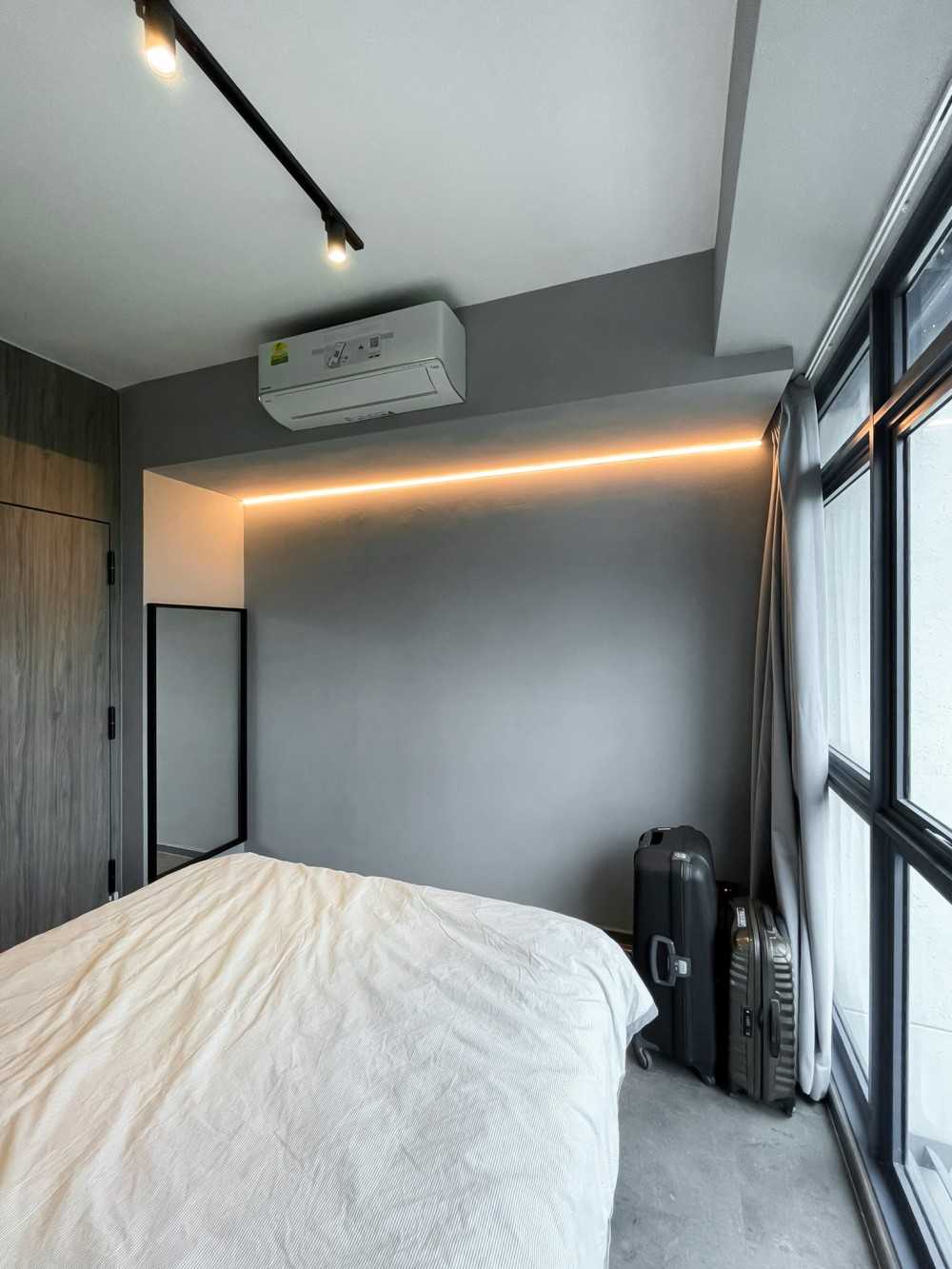 Scandinavian Bedroom with Window Grille and Paintings