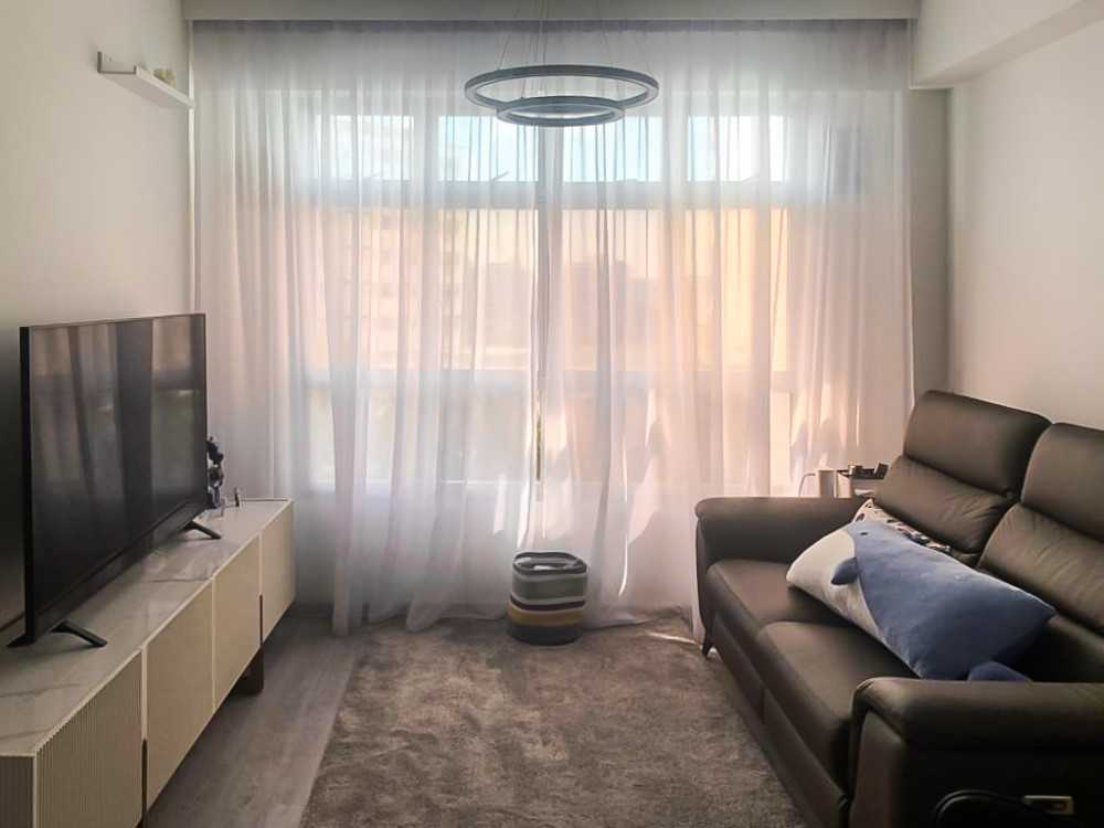 Scandinavian Living Room with TV Console and Window Grille