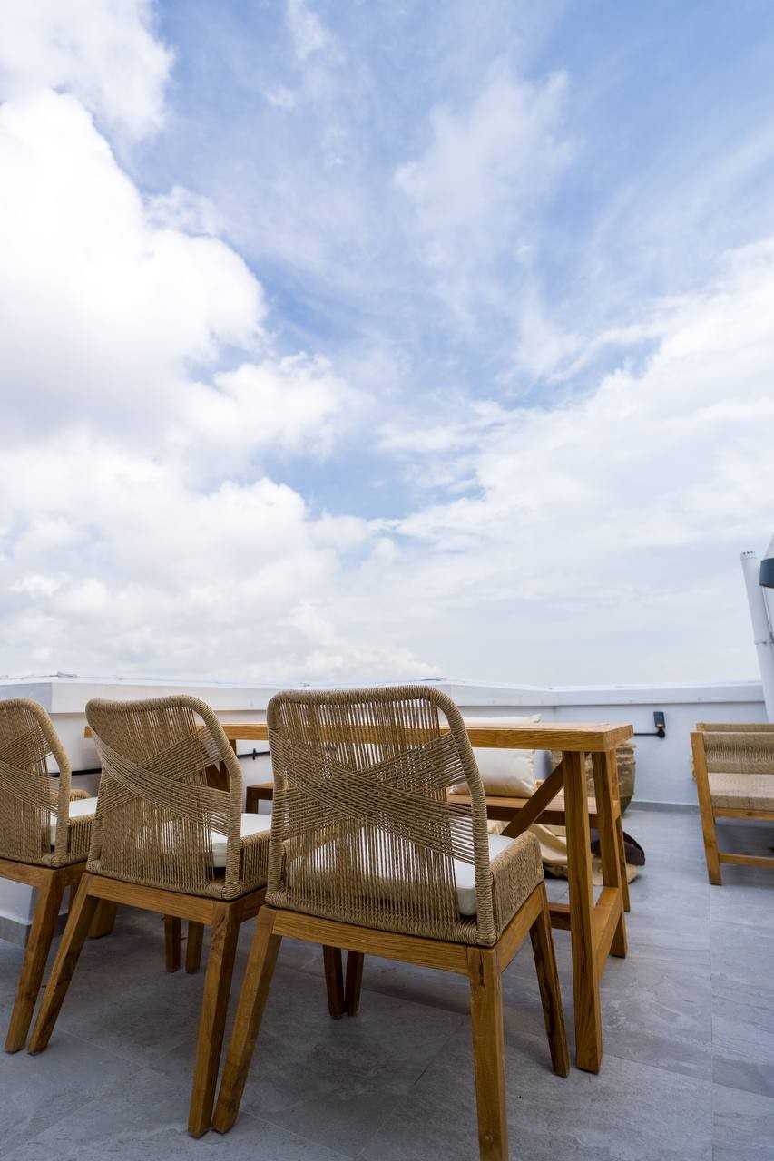 Scandinavian Rooftop with Outdoor Table and Outdoor Chairs