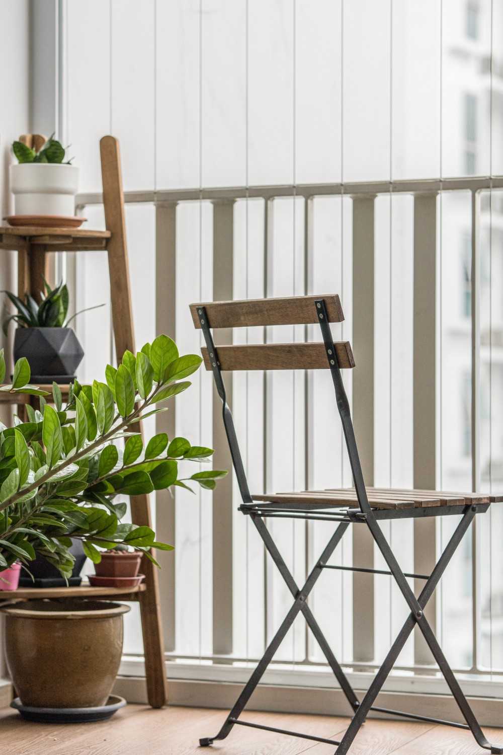 Contemporary Balcony with Outdoor Chairs and Houseplants