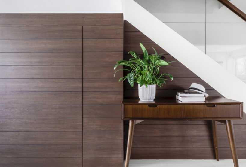 Contemporary Hallway with Homogeneous Tiles and Feature Wall