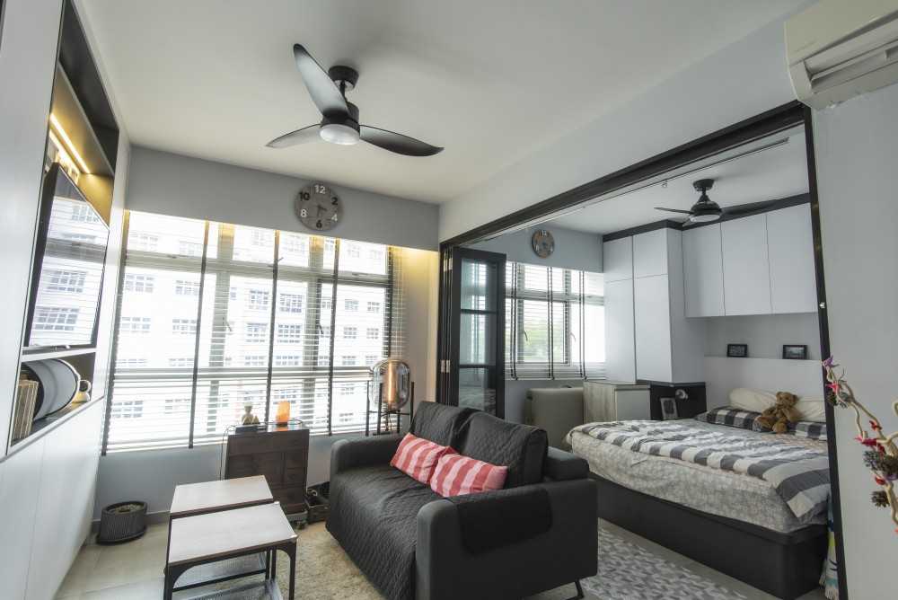 Modern Living Room with Bookshelf and Homogeneous Tiles