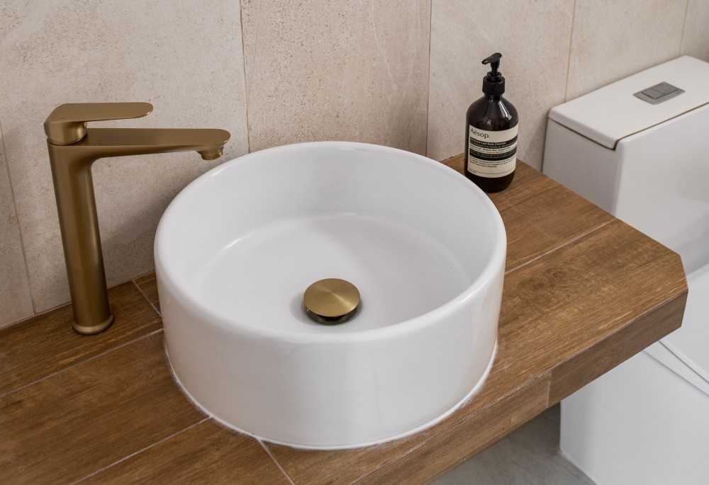 Minimalist Bathroom with Countertop and Herringbone Tiling