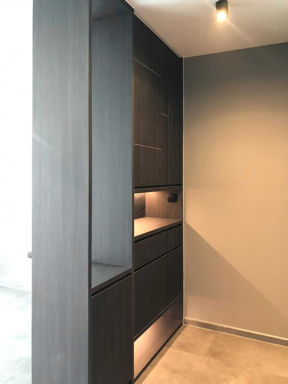 Scandinavian Foyer with Paintings and Storage Cabinets