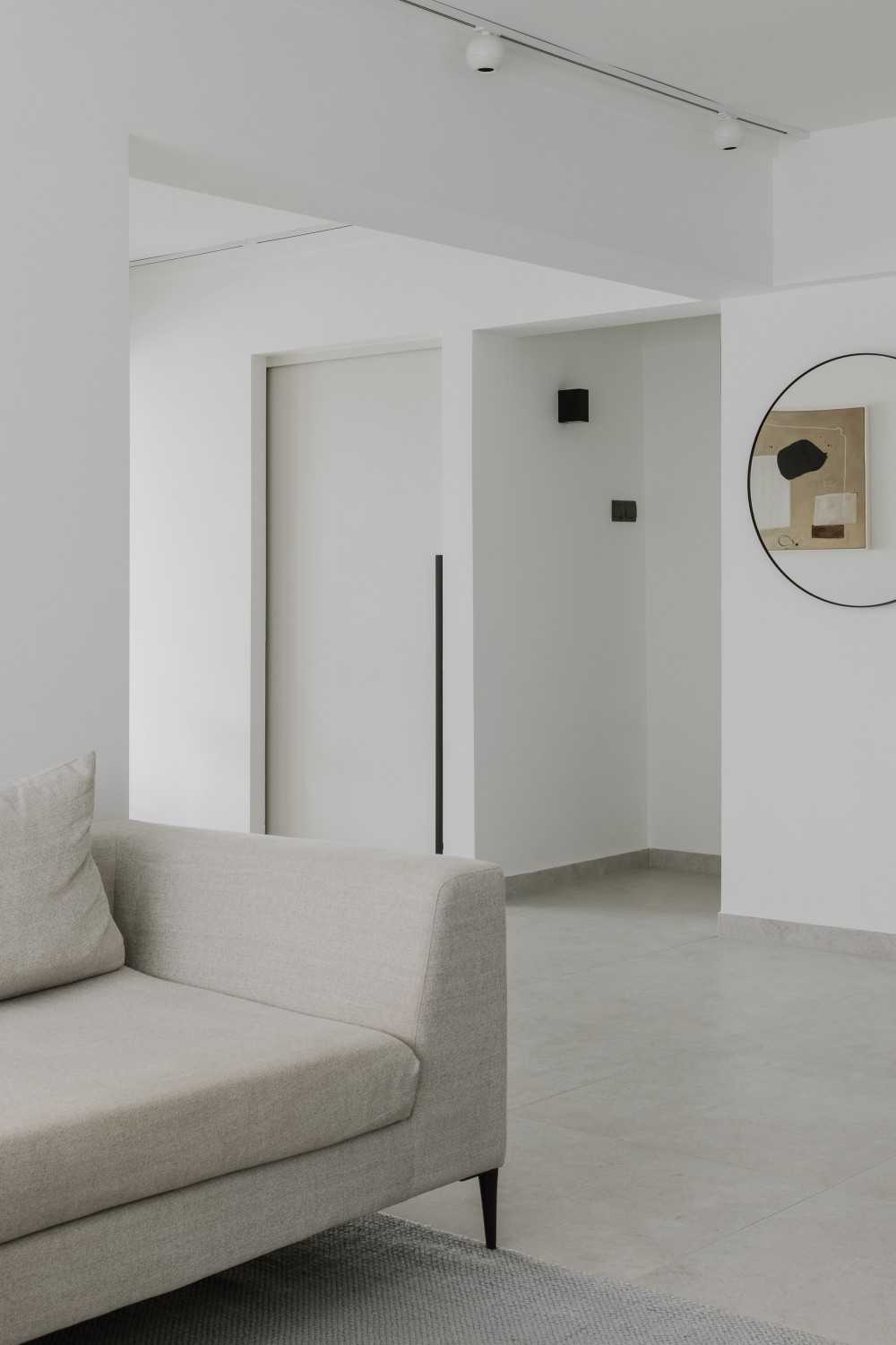 Modern Living Room with Mirror and Ceiling Light