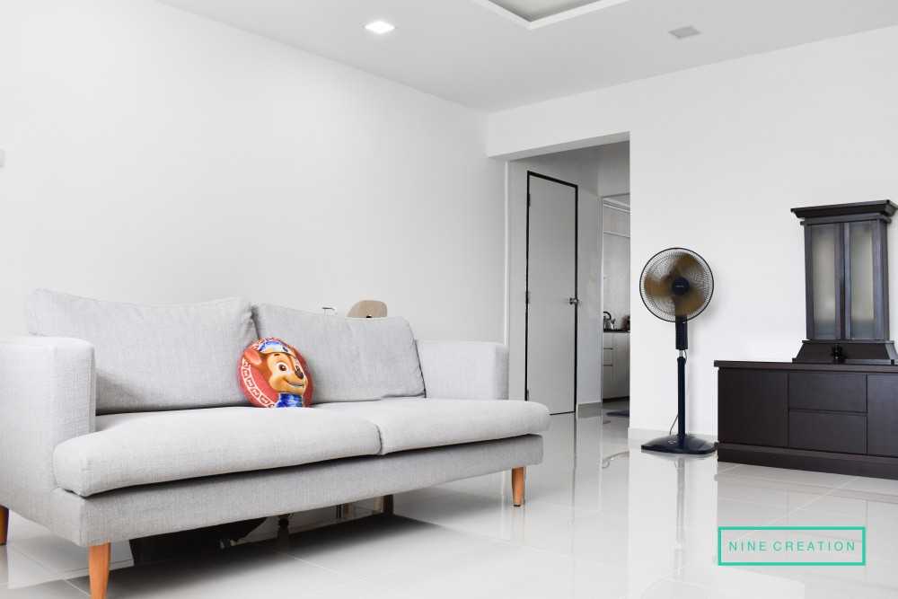 Minimalist Living Room with Bookshelf and Homogeneous Tiles