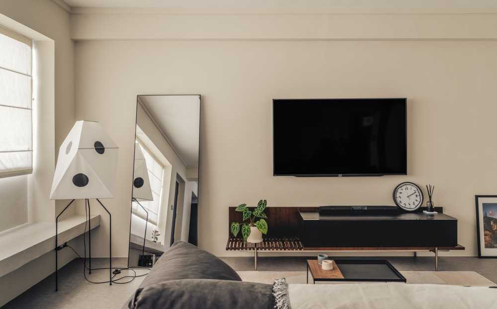 Minimalist Living Room with TV Console and Mirror