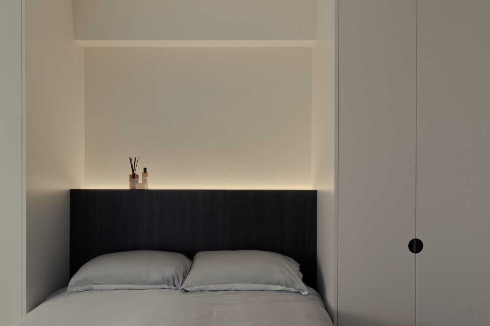 Minimalist Bedroom with Cove Lighting and Wardrobe