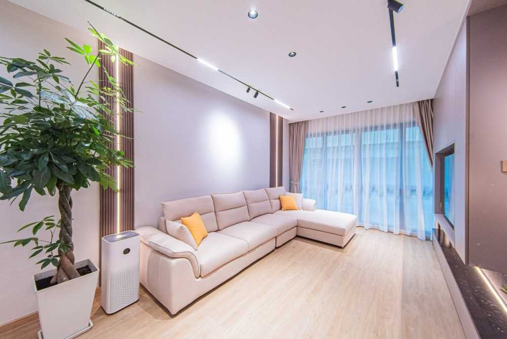 Modern Living Room with Vinyl Flooring and Feature Wall
