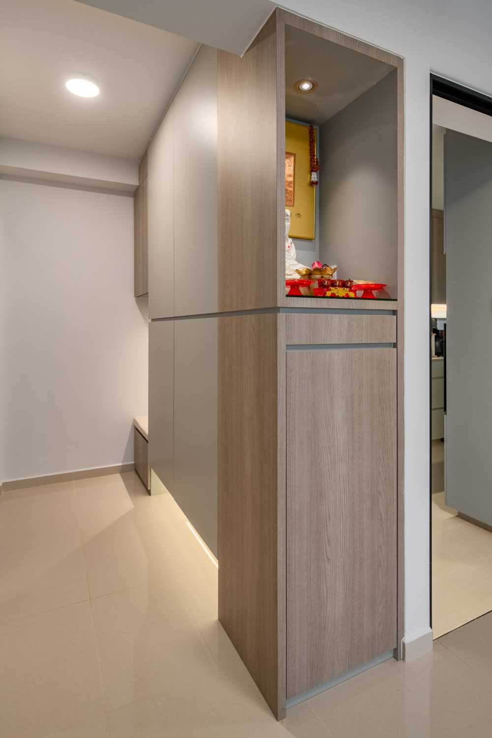 Minimalist Foyer with Artwork and Storage Cabinets