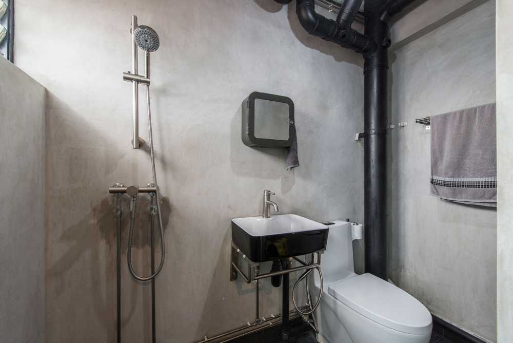 Industrial Bathroom with Cement Floor and Bathroom Accessories