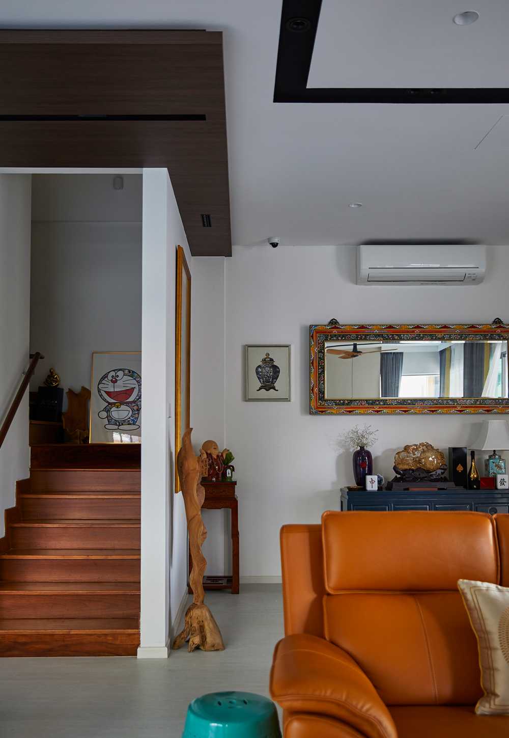 Scandinavian Living Room with Staircase and Paintings