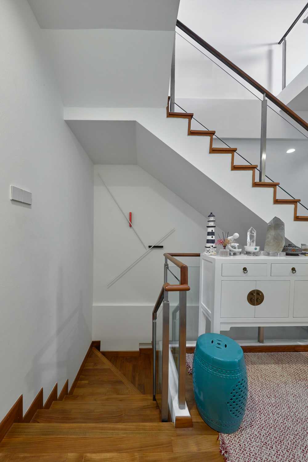 Scandinavian Hallway with Staircase and Paintings