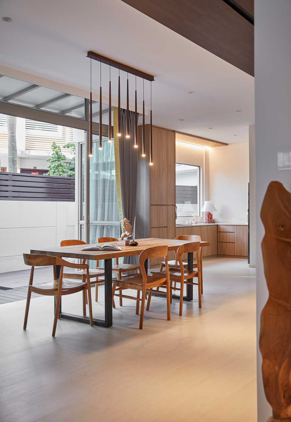 Scandinavian Dining Room with Glass Door and Paintings