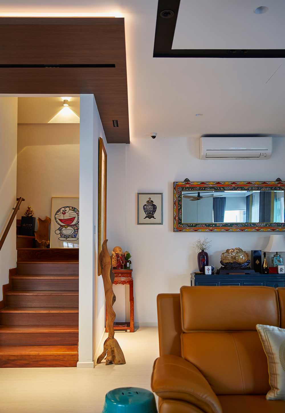 Scandinavian Living Room with Staircase and Paintings