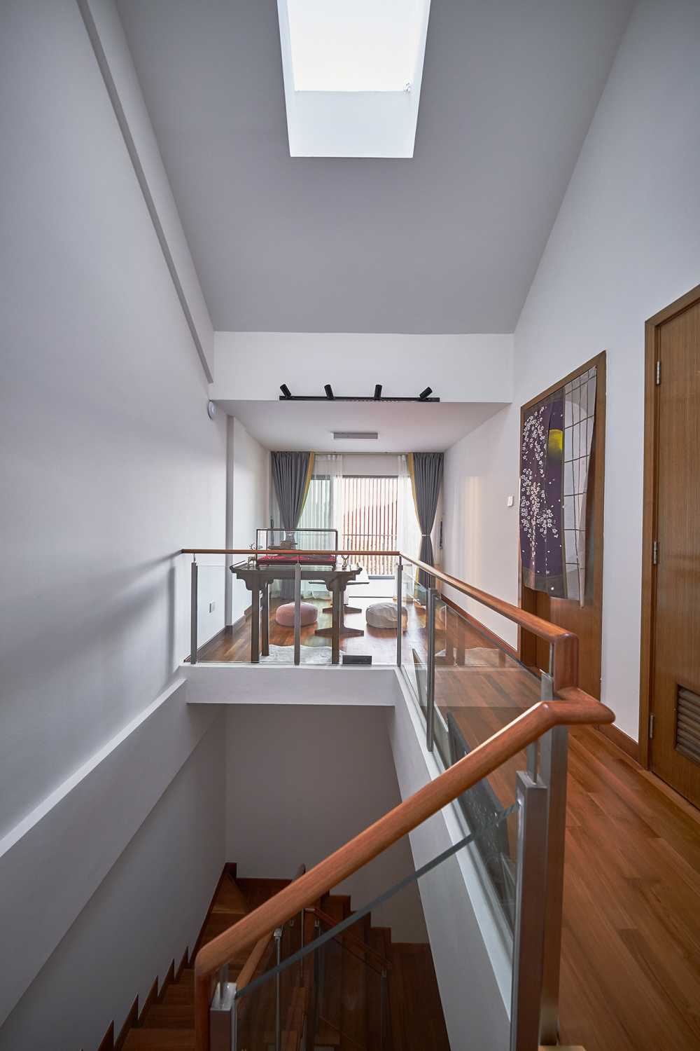 Scandinavian Hallway with Staircase and Paintings