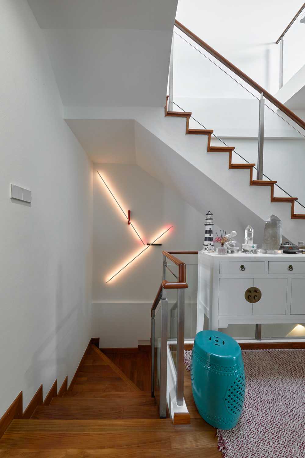 Scandinavian Hallway with Staircase and Paintings