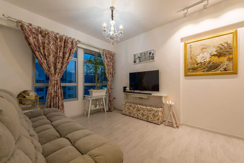 Country Living Room with Vinyl Flooring and Chandelier