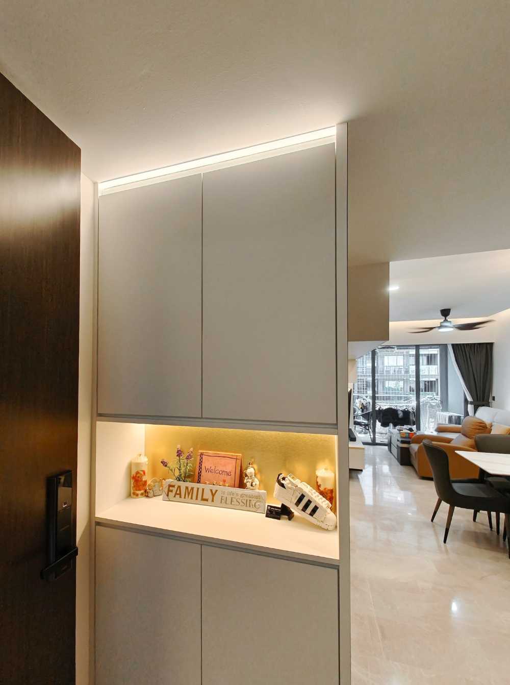 Scandinavian Foyer with Paintings and Storage Cabinets