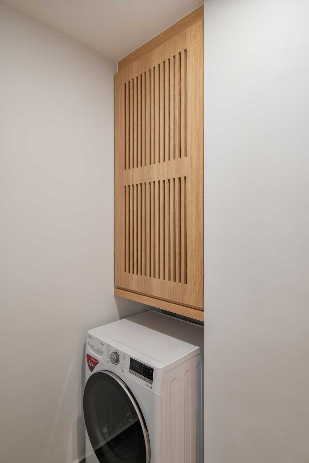 Minimalist Service Yard with Washing Machine and Laundry Area
