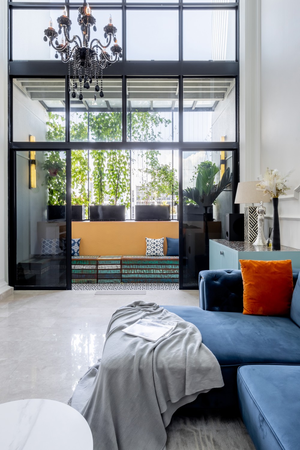 Eclectic Living Room with Feature Wall and Chandelier