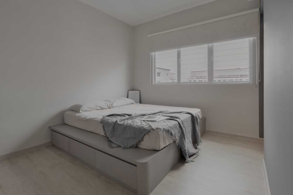 Scandinavian Bedroom with Wood Flooring and Window Shutters
