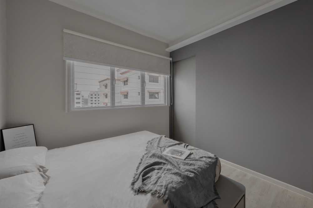 Scandinavian Bedroom with Wood Flooring and Window Shutters
