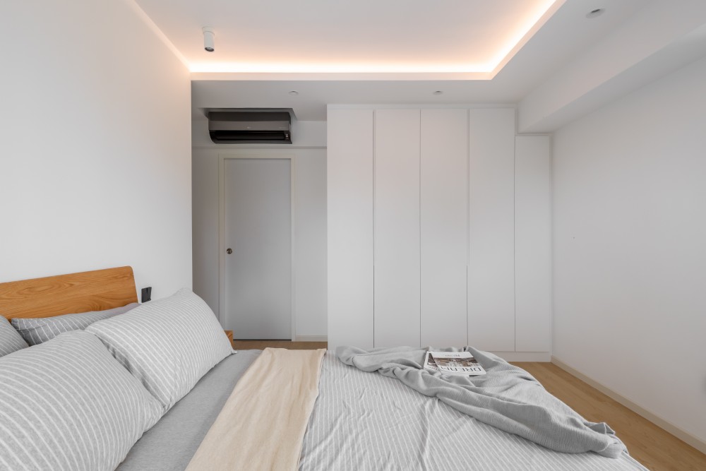 Minimalist Bedroom with Vinyl Flooring and Cove Lighting