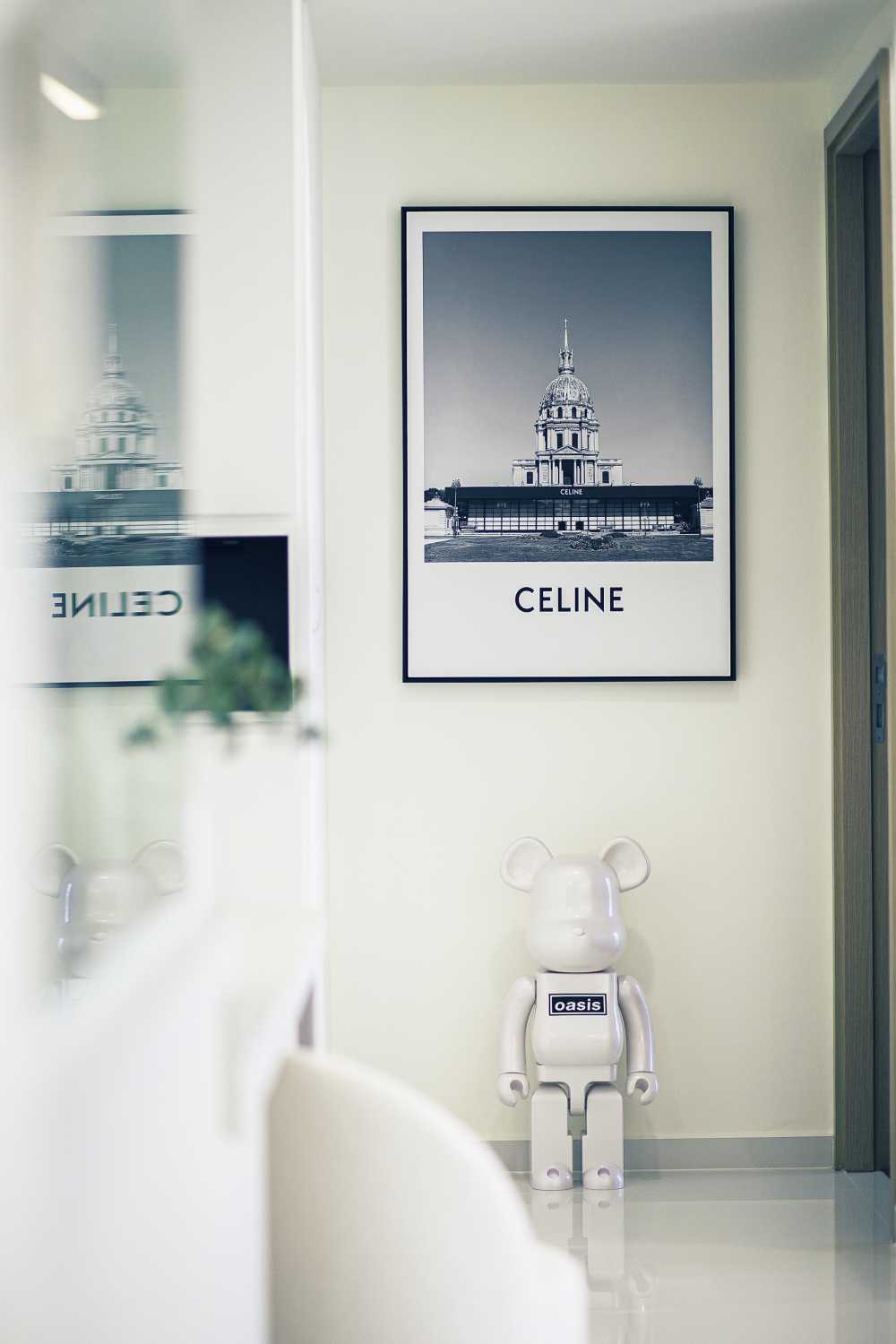 Minimalist Entryway with Glass Door and Paintings