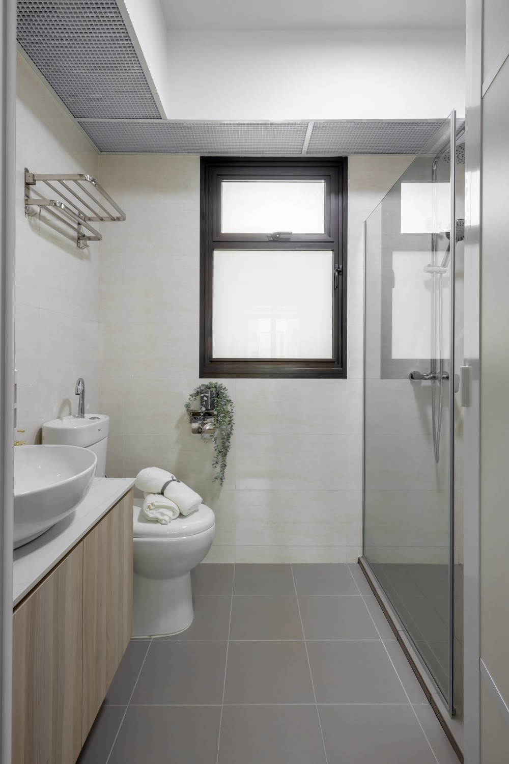 Minimalist Bathroom with Homogeneous Tiles and Shower Screen