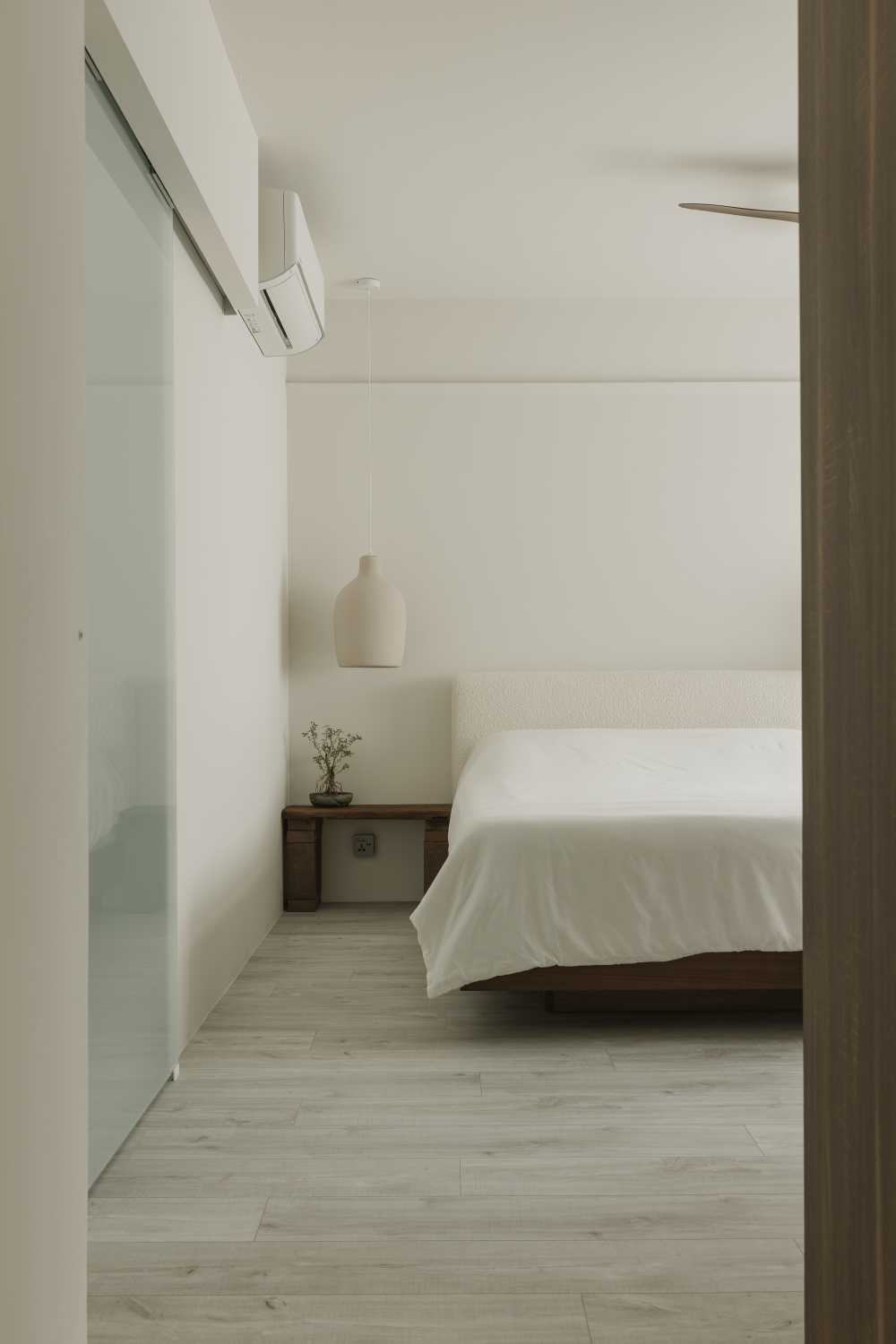 Minimalist Bedroom with Bedside Table and Flooring