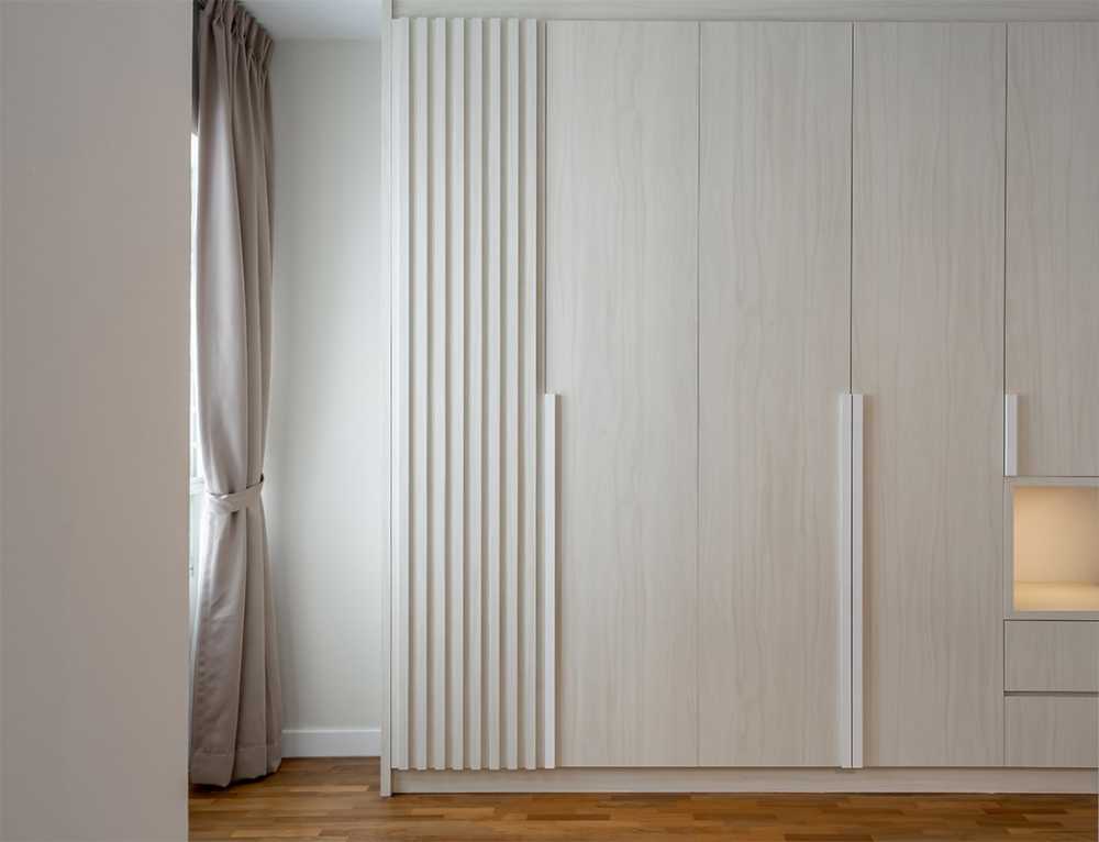 Contemporary Bedroom with Parquet Floor and Cove Lighting