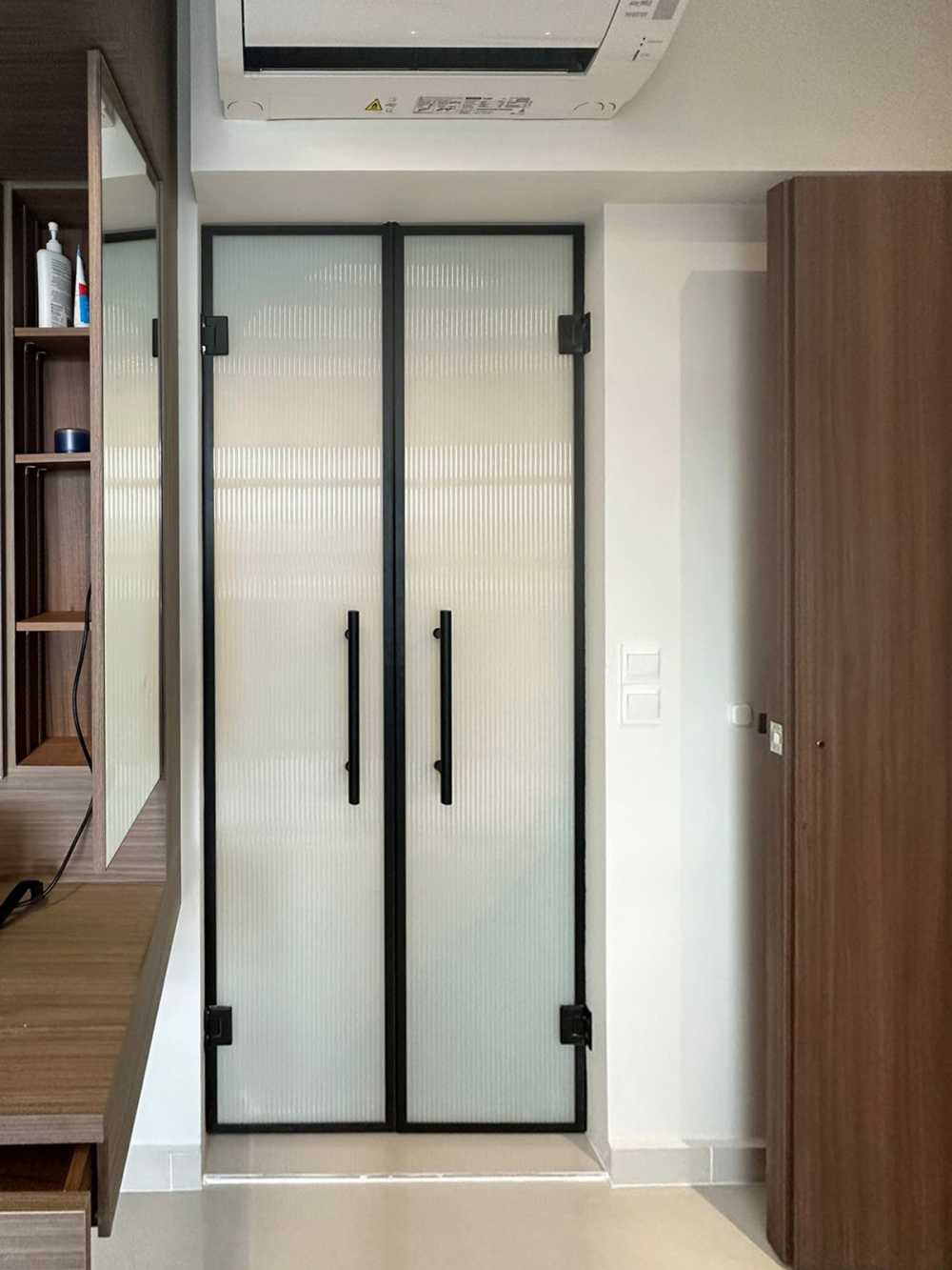 Scandinavian Bedroom with Glass Door and Paintings