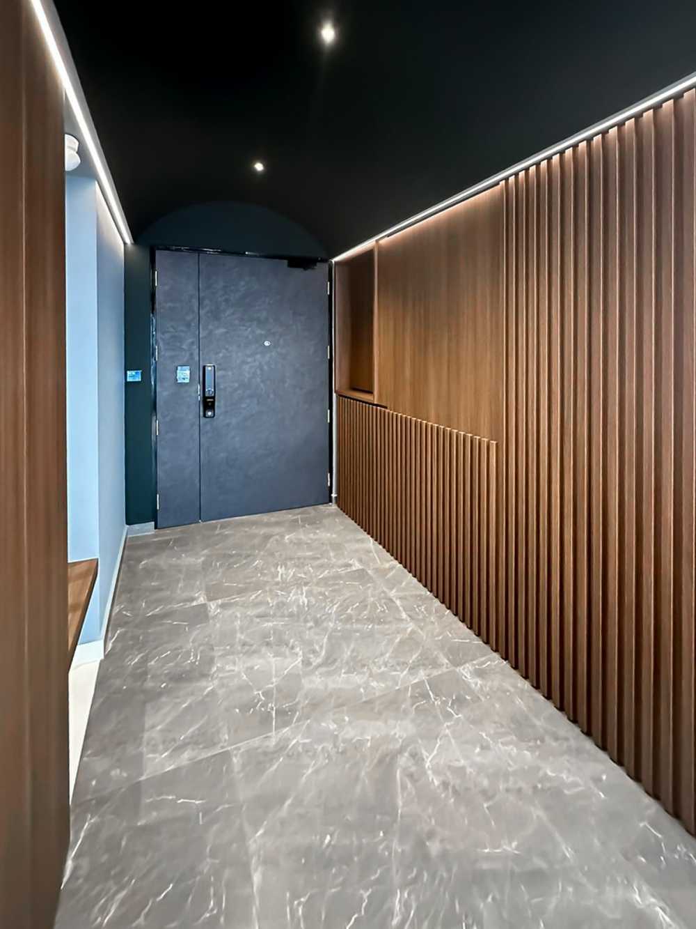 Scandinavian Foyer with Panelling and Display Cabinets