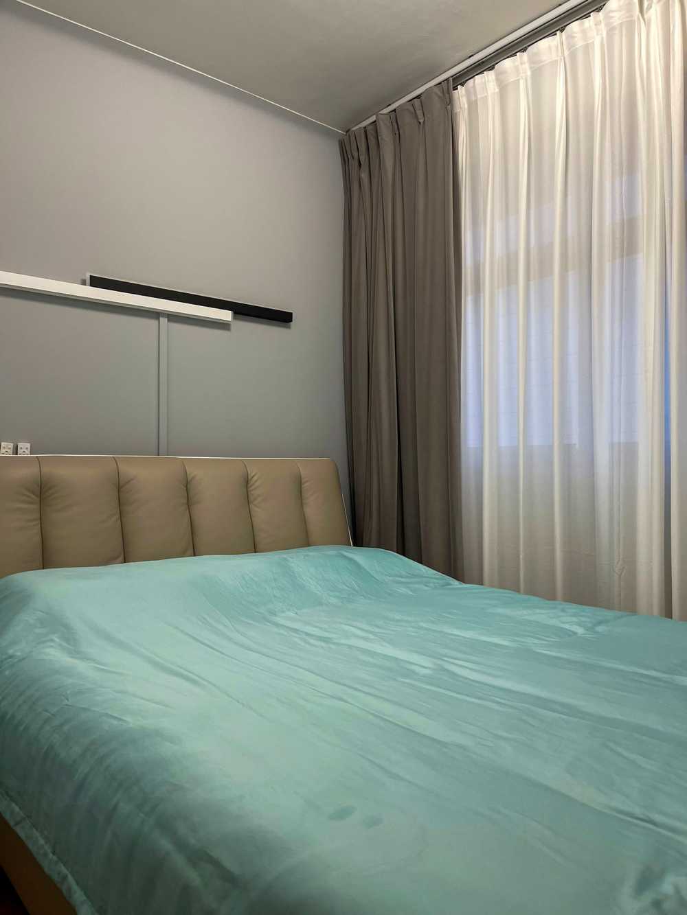 Minimalist Bedroom with Curtain and Queen Bed