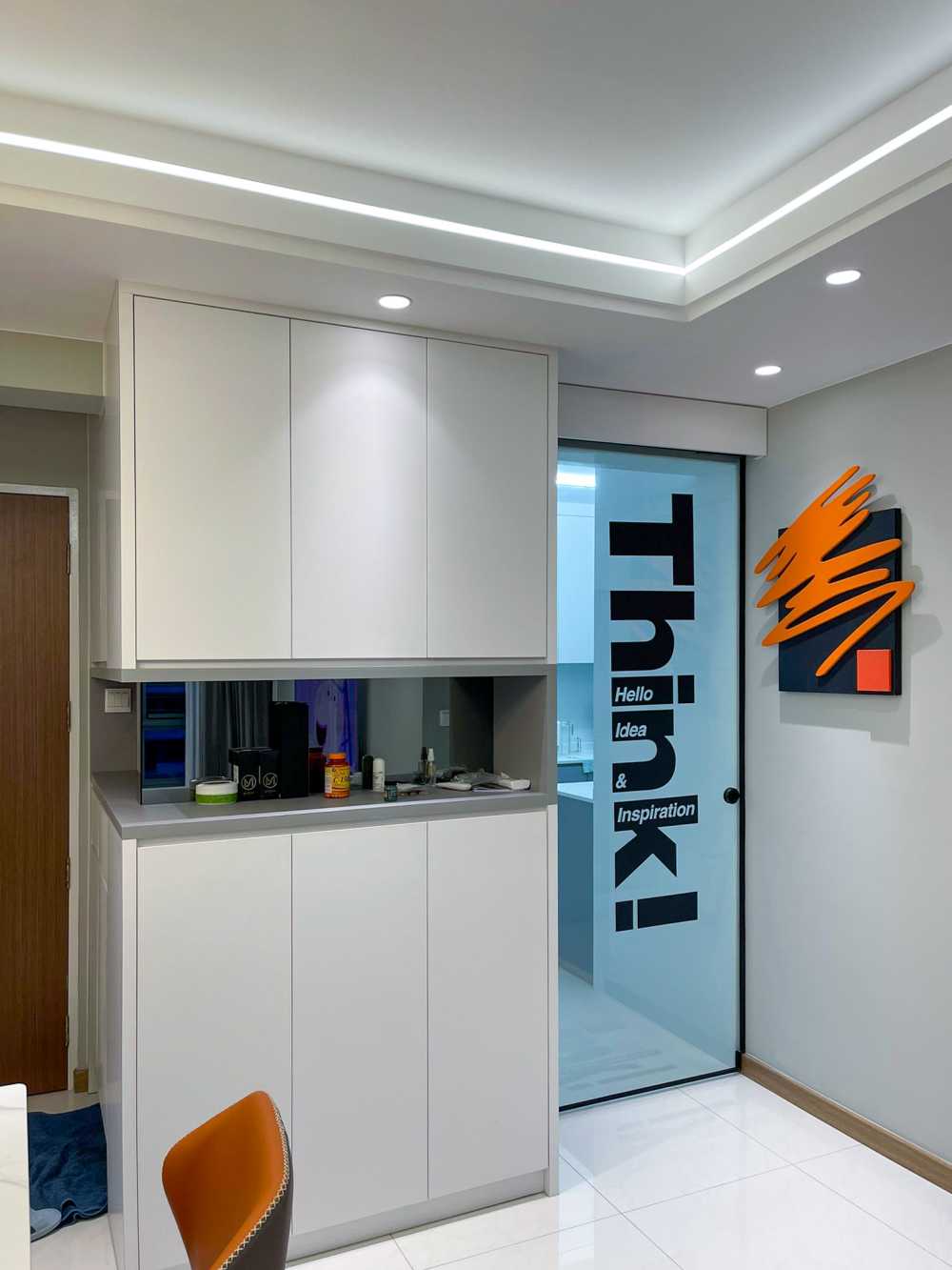 Minimalist Dining Room with Cove Lighting and Glass Door