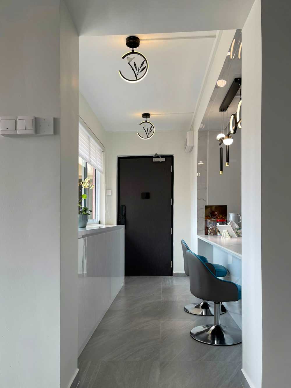 Modern Entryway with Roller Blinds and Storage Cabinets
