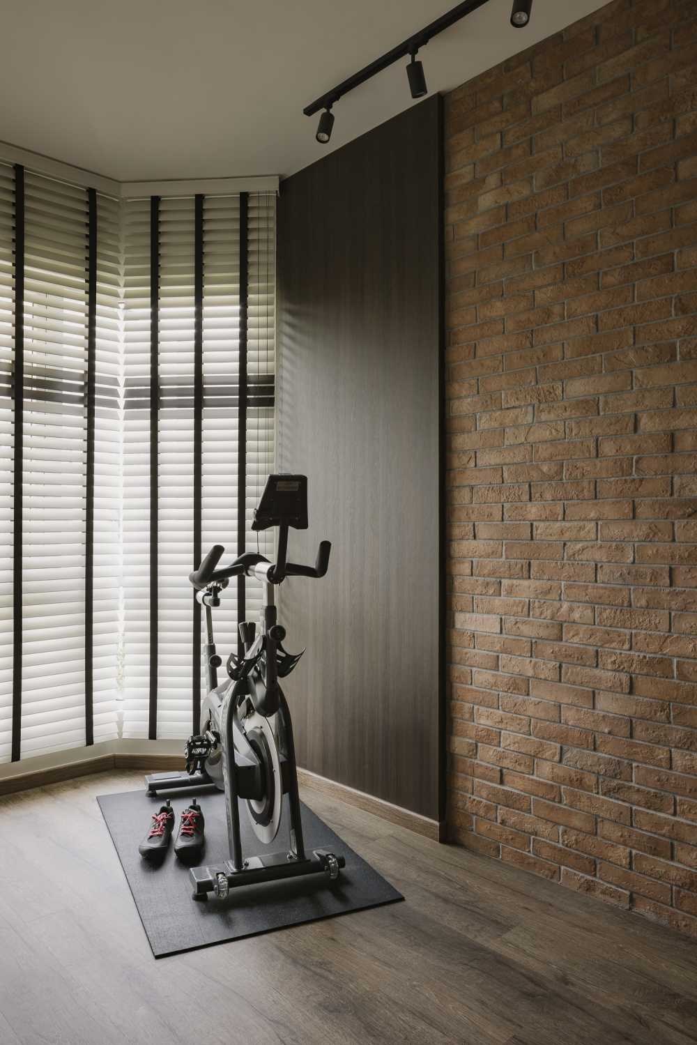 Industrial Home Gym with Vinyl Flooring and Feature Wall