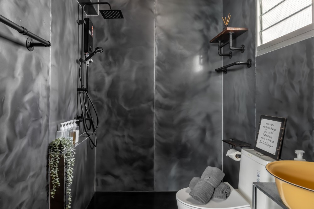 Industrial Bathroom with Homogeneous Tiles and Rainshower