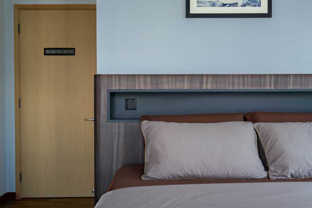Contemporary Bedroom with Cement Floor and Wood Flooring