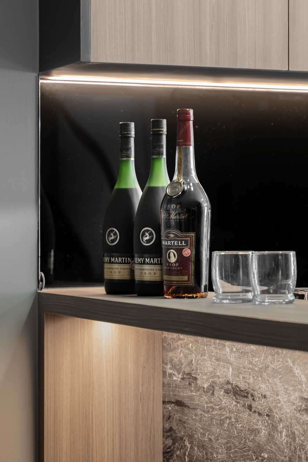 Contemporary Wine Cellar with Drinkware and Shelving Units