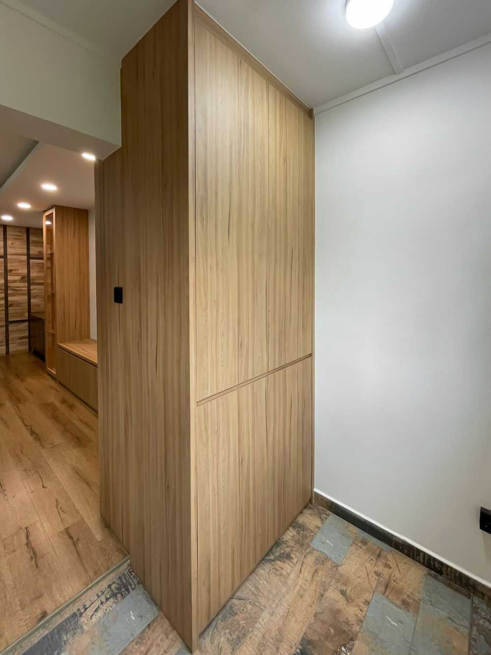 Scandinavian Foyer with Paintings and Display Cabinets