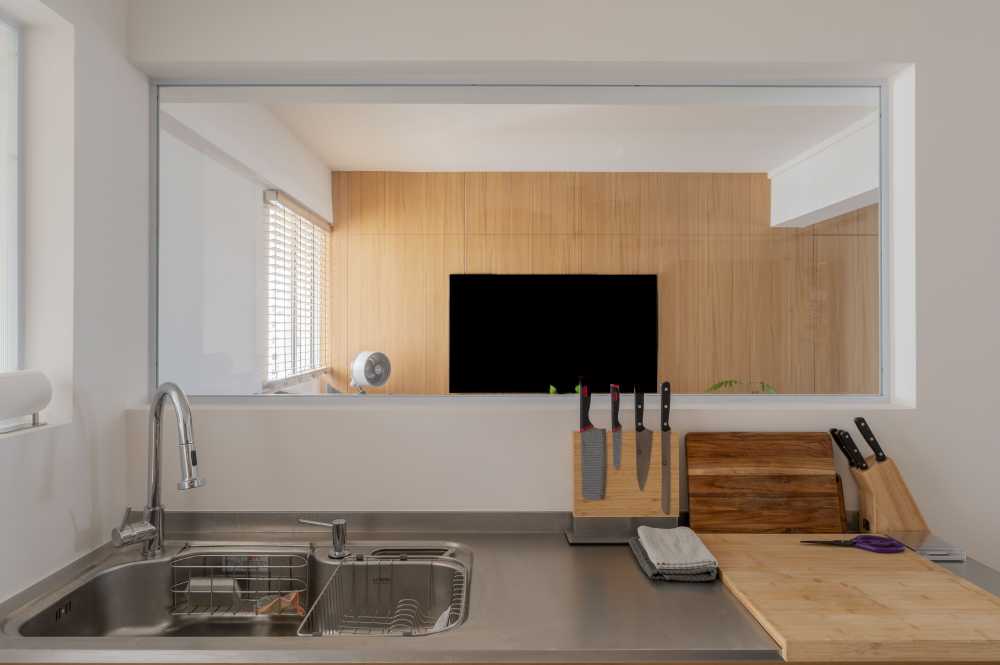 Scandinavian Kitchen with Homogeneous Tiles and Kitchen Window
